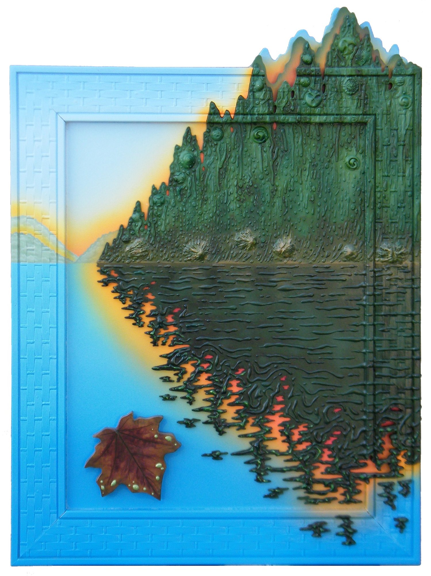 A forested ridge and its reflection rise from a framed blue lake, with a red maple leaf at the lower left.